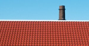 brown roof across blue sky