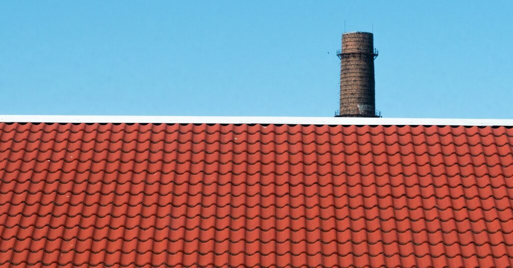 brown roof across blue sky